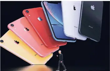  ?? FOTO: AFP ?? Eins, zwei, drei, ganz viele: Apple-chef Tim Cookbei der Präsentati­on des iphone 11.