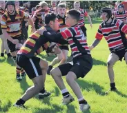  ??  ?? ●●Emilio Ramirez gets swallowed up in the tackle against Altrincham Kersal