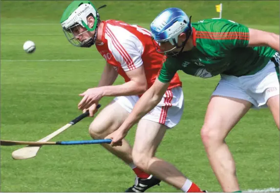  ?? Pictu res: Kieran Carr ?? Ryan Walsh secures possession for Louth under pressure from Mayo’s Ray Walsh.