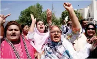  ?? Reuters ?? STILL THEIR LEADER: Supporters of Sharif chant slogans following the Supreme Court decision in Islamabad. —