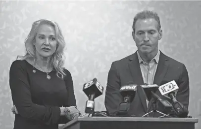  ?? TINA MACINTYRE-YEE/ROCHESTER DEMOCRAT AND CHRONICLE ?? Mary Znidarsic-Nicosia and her husband, Nicholas Nicosia hold a press conference with their lawyer, Corey Hogan, at the Hilton Garden Inn in Pittsford, N.Y., in August 2022.
