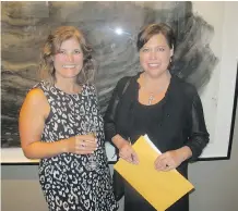  ??  ?? Cathy Askin, left, and Carmen Hunchak were among the guests taking in the wonderful art at the auction.