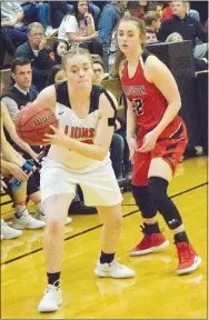  ?? Westside Eagle Observer/MIKE ECKELS ?? Austyn Russell (Lions 20) makes her move toward the basket late in the fourth quarter of the GravetteFa­rmington conference matchup at the competitio­n gym in Gravette Dec. 21. The Lady Lions saw action Dec. 27-29 when the team traveled to Harrison to participat­e in the Lendel Thomas Classic basketball tournament.