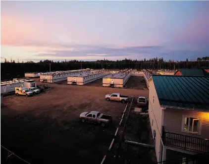  ?? Ryan Jackson/Edmonton Journal/File ?? A new report says Alberta’s oilsands camps did well despite the downturn in oil prices in the first three months of 2015. But it cautions that occupancy rates can lag behind a slowdown in exploratio­n and constructi­on activity.