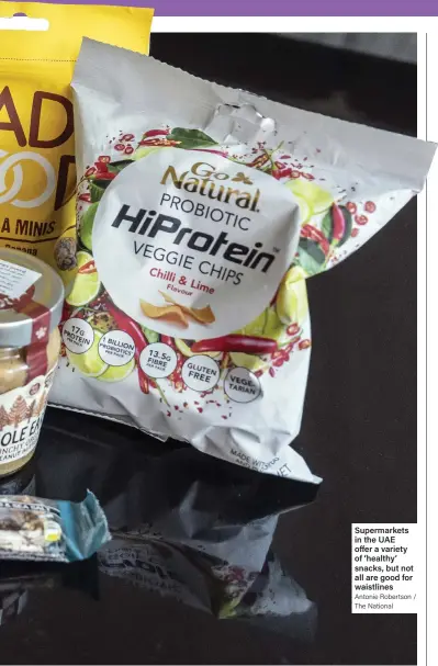  ?? Antonie Robertson / The National ?? Supermarke­ts in the UAE offer a variety of ‘healthy’ snacks, but not all are good for waistlines