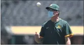  ?? EZRA SHAW — GETTY IMAGES ?? A’s manager Bob Melvin tosses a ball in the air during summer workouts at Oakland Coliseum.