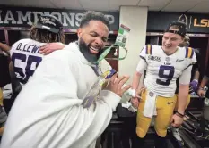 ?? CHRIS GRAYTHEN/ GETTY IMAGES ?? Odell Beckham Jr. celebrates in the locker room with Joe Burrow in January after LSU won the national title.