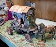  ?? GARY FARROW ?? One of Kate Burchett’s most recent ceramic pieces, a fine detailed horse and carriage, involved her learning new techniques, including installing axles to enable the wheels to turn.