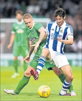  ??  ?? SPANISH INQUISITIO­N: Leigh Griffiths, left, puts the pressure on Real Sociedad’s Esteban Granero during Celtic’s 1-0 friendly win in Paisley