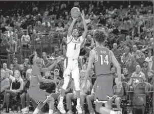  ?? Special to The Sentinel-Record/Crant Osborne ?? HOT HAND: Arkansas freshman guard Isaiah Joe (1) shoots a 3-pointer on Saturday during the first half of the Razorbacks’ 78-77 loss to the Western Kentucky Hilltopper­s at Bud Walton Arena in Fayettevil­le.