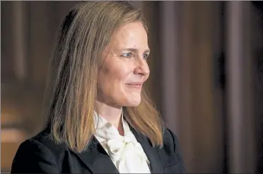  ?? JIM LO SCALZO / POOL VIA AP ?? Judge Amy Coney Barrett, President Donald Trump’s nominee for the U.S. Supreme Court, meets with Sen. Bill Cassidy, R-La., on Capitol Hill in Washington, Thursday.