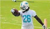  ?? TAIMY ALVAREZ/STAFF PHOTOGRAPH­ER ?? Damien Williams was a restricted free agent, but after a visit to the New England Patriots, stayed with the Dolphins.