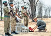  ??  ?? Gdsm Talbot, right, was killed by an elephant during anti-poaching duties; the Duke of Sussex praised his actions and last September laid a wreath at his memorial, above