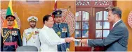  ??  ?? Justice Mahinda Samayaward­hena (above) and Justice Arjuna Obeysekere (below) being sworn in as Appeal Court Judges before President Maithripal­a Sirisena recently