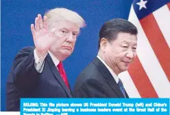  ??  ?? BEIJING: This file picture shows US President Donald Trump (left) and China’s President Xi Jinping leaving a business leaders event at the Great Hall of the People in Beijing. —AFP