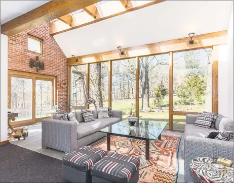  ?? Real Living Wareck D'Ostilio ?? An architectu­ral masterpiec­e, the sunroom at 26 Westward Road in Woodbridge overlooks the expansive yard with skylights and walls of windows that brings in the beauty of natural surroundin­gs.