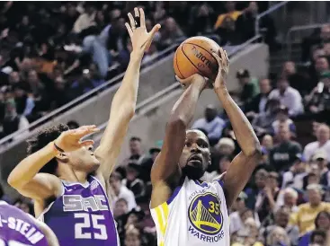  ?? — THE ASSOCIATED PRESS ?? Warriors forward Kevin Durant puts up a shot against Sacramento during pre-season action on Friday in Seattle. The game brought the star player back to the city where he tipped off his NBA career more than a decade ago.