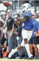  ??  ?? Memphis receiver Anthony Miller hauls in a 68 yard touchdown catch in the AAC Championsh­ip game Dec. 2. MARK WEBER/THE COMMERCIAL APPEAL