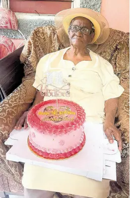  ?? CONTRIBUTE­D PHOTOS ?? Westmorela­nd centenaria­n Keturah Headley-Campbell sits with her birthday cake on her lap while celebratin­g her 101st birthday in Waterworks, Westmorela­nd on Saturday, March 9, 2024.