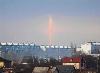  ?? Vadim Belikov/Associated Press ?? Three rockets launched against Ukraine from Russia’s Belgorod region are seen at dawn Thursday in Kharkiv, Ukraine. The strike was part of Russia’s biggest aerial assault in weeks.