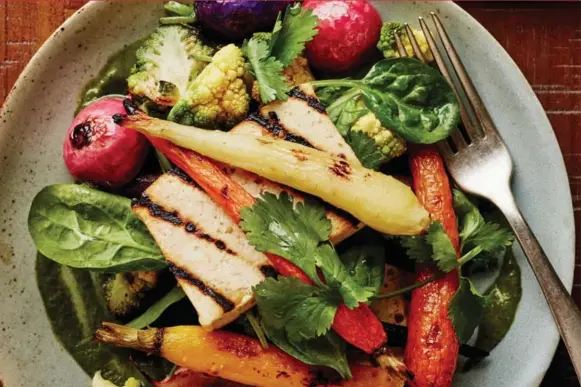  ?? COURTESY RICARDO ?? This tofu with roasted garden vegetables and cilantro dressing is a comforting, healthy weeknight bowl, bursting with carrots, radishes, broccoli, carrots and spinach.