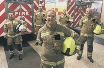  ??  ?? Firefighte­r Samantha Evans, front, with colleagues