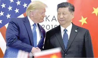  ?? SUSAN WALSH/AP FILES ?? President Donald Trump shakes hands with Chinese President Xi Jinping in June 2019.
