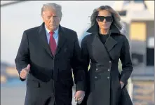  ?? PATRICK SEMANSKY / AP ?? President Donald Trump and first lady Melania Trump board Air Force One at Andrews Air Force Base, Md., Wednesday, traveling to his Mar-aLago resort in Palm Beach, Fla.