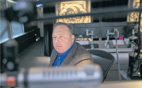  ?? NYT ?? Alex Jones, the conservati­ve host of Infowars.com, is seen in his Austin control room in February last year. In 2018, Apple, Facebook, YouTube and Spotify removed large portions of content posted by Jones in what is seen as a major step to curb one of the most prominent online voices traffickin­g what they deem as misinforma­tion.