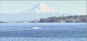  ?? Paul Grondahl / Special to the Times Union ?? Nothing like a view of Mount Rainier over Tacoma’s Commenceme­nt Bay on a clear day to lift one’s spirits in a pandemic.