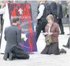  ??  ?? >
Rev Fr Martin Newell, left, at one of his peace demonstrat­ions