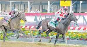  ?? Julio Cortez The Associated Press ?? Early Voting, with Jose Ortiz aboard, heads to the finish line for a victory in the Preakness Stakes on Saturday.