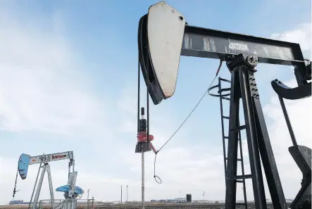  ?? IAN KUCERAK ?? Idle oil pump jacks are seen in a field near Leduc, Alta. As prices rebound from historic lows, the oil business in Western Canada is again making capital investment­s. Drilling activity was strong in the three months ended June 30, and some are using the extra cash flow to buy back shares.