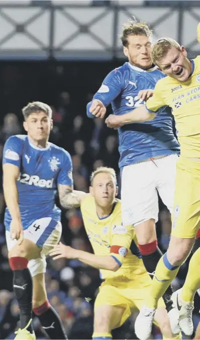  ??  ?? 0 Striker Joe Garner rises above the St Johnstone defence to head home Rangers’ equaliser.