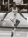  ?? Chuck Burton / Associated Press ?? Texas’ Greg Brown dances after a making 3-point basket against Oklahoma State during the second half.