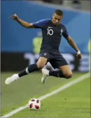  ?? NATACHA PISARENKO — ASSOCIATED PRESS ?? France’s Kylian Mbappe leaps over the ball during Tuesday’s semifinal match against Belgium in St. Petersburg, Russia.