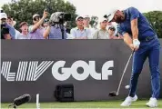  ?? Lynne Sladky/Associated Press ?? Dustin Johnson hits from the third tee during the second round of the LIV Golf Team Championsh­ip at Trump National Doral Golf Club on Oct. 29 in Doral, Fla.