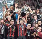  ?? JOHN DAVID MERCER/USA TODAY SPORTS ?? Atlanta United’s Michael Parkhurst celebrates with the MLS Cup after he and teammates defeated the Portland Timbers for the championsh­ip.