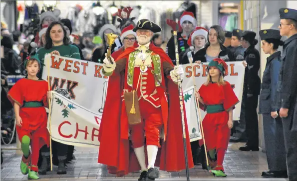  ??  ?? Town Crier Lloyd Smith got the parade off to a merry start.