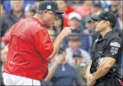  ?? CHARLES KRUPA / ASSOCIATED PRESS ?? Manager John Farrell (left, arguing with home plate umpire Mark Wegner on Monday) was 432-378 over five seasons with Boston.