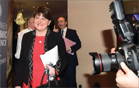  ?? Photo by Michelle Cooper Galvin ?? DUP leader Arlene Foster at the Killarney Economic Conference at The Brehon, Killarney, with Fianna Fáil leader Michel Martin in the background.