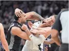  ?? COX / USA TODAY SPORTS KELLEY L ?? Bucks center Brook Lopez gets into a scrap with Trey Lyles after the Kings center shoved Giannis Antetokoun­mpo late in the game Monday night.