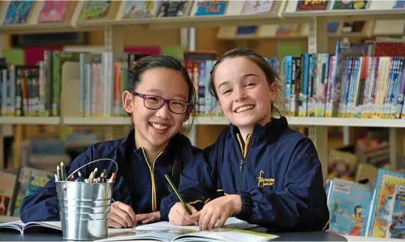  ?? PHOTO: KEVIN FARMER ?? TEST SCORES: Fairholme College students Rachel Yap (left) and Grace Cornford are part of the high-achieving Year 5 cohort.