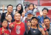  ?? AFP ?? Naomi Osaka poses with fans after beating Julia Goerges.