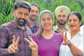  ?? HT PHOTO ?? ■ Jasmine Kaur Chahal celebrates her feat with her family in Jalandhar on Monday.