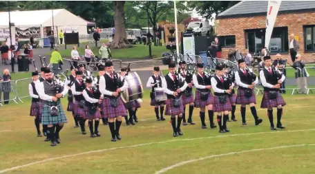  ?? ?? Isle of Arran Music Schools’ Competitio­n Pipe Band perform at the RSPBA Scottish Championsh­ips last year.