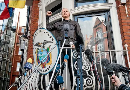  ?? GETTY IMAGES ?? Julian Assange declares ‘‘victory’’ as he speaks to the media from the balcony of the Ecuadorian embassy in London yesterday. Sweden has ended its investigat­ion into sexual assault allegation­s against Assange, but he still risks arrest if he leaves the...