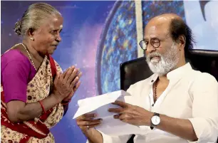  ?? PTI ?? Tamil superstar Rajinikant­h meeting with a fan in Chennai on Thursday. —