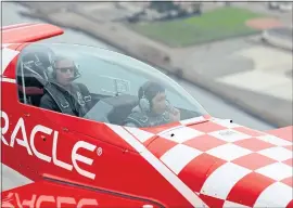  ?? ANDA CHU/BAY AREA NEWS GROUP ?? Aerobatic pilot Sean D. Tucker flies Chris Cheam, 13, of Oakland, over Oakland on Thursday. Cheam was invited to go on the flight through the EAA Young Eagles program.