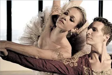  ?? Art Lessman The George Balanchine Trust ?? AMERICAN Contempora­ry Ballet’s Cara Hansvick and Mate Szentes in Balanchine version of “Nutcracker.”